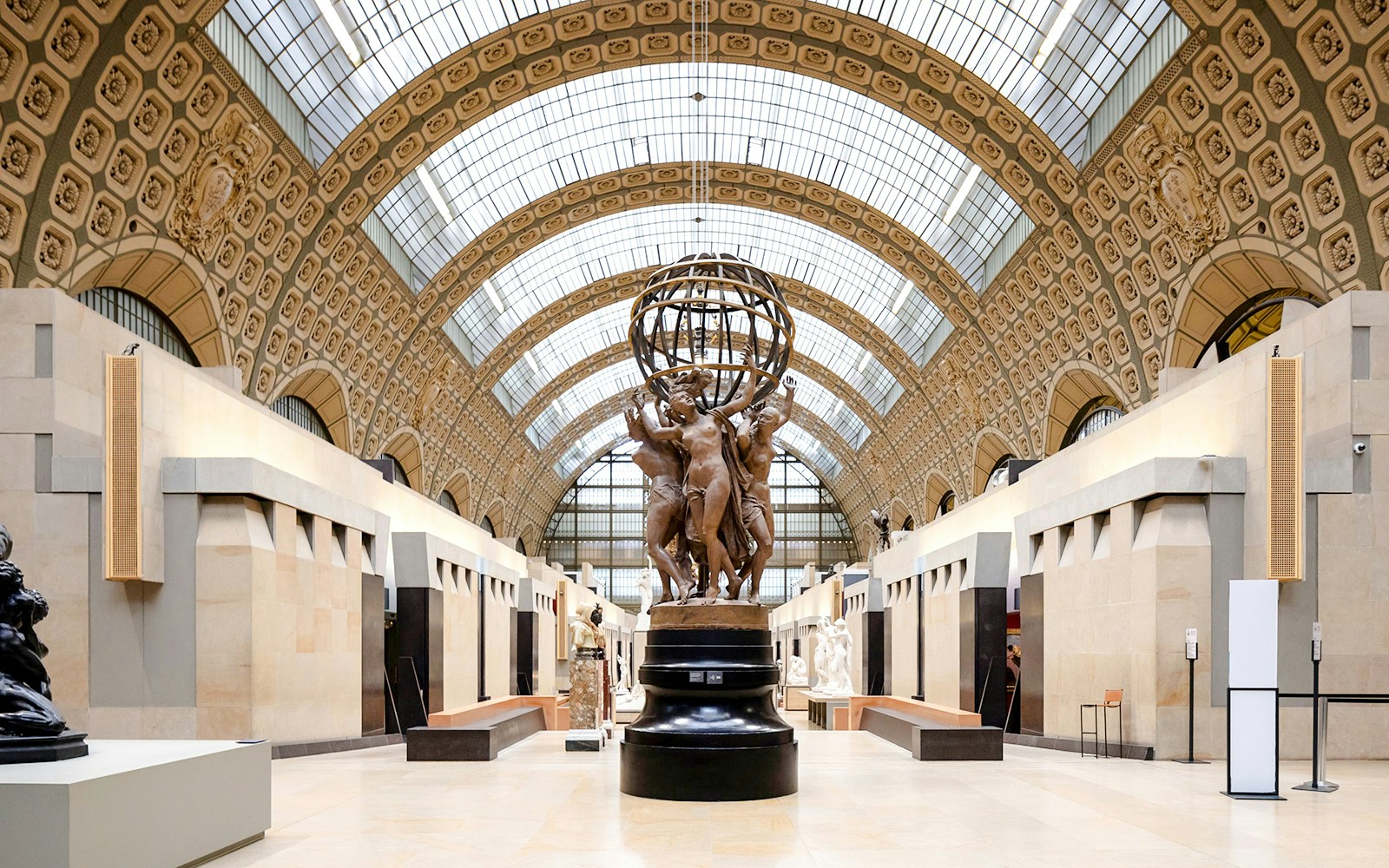 Orsay Museum interior with sculptures and ornate ceiling, Paris, France.