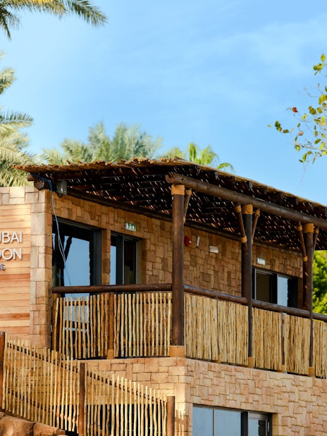 The Dubai Balloon building at Atlantis surrounded by palm trees.