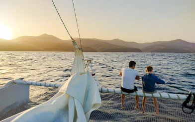 Tourists on a cruise boat at sunset in Lanzarote, preparing to watch whales and dolphins.