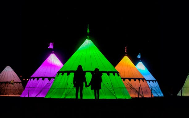 Colorful illuminated tents at Warwick Castle Light Trail.