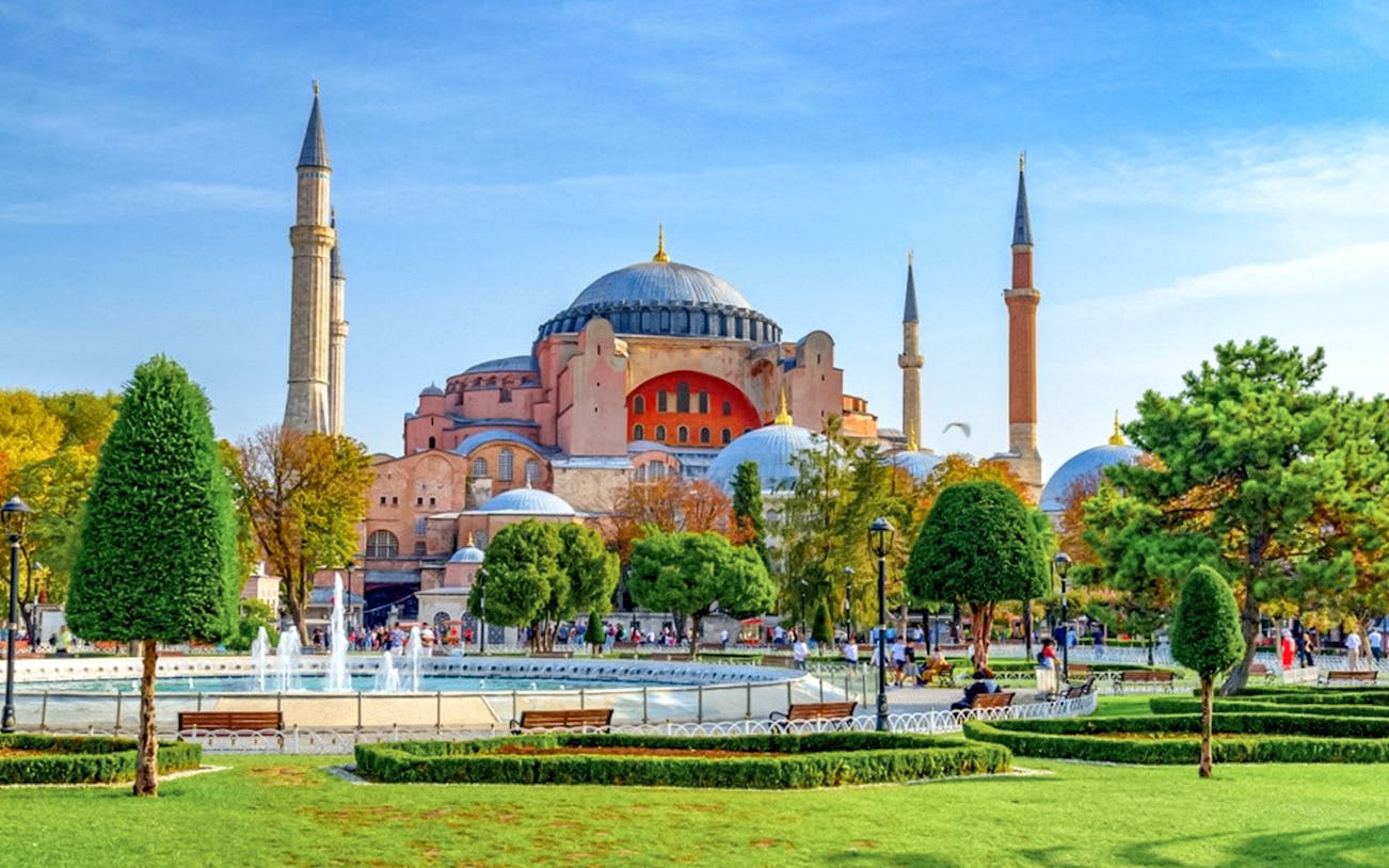 Hagia Sophia exterior with minarets and gardens in Istanbul.