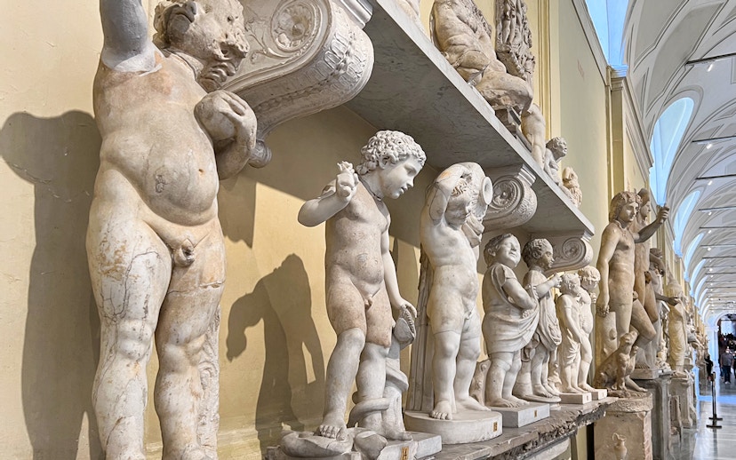 Marble statues in the Vatican Museums corridor, part of the skip-the-line tour.