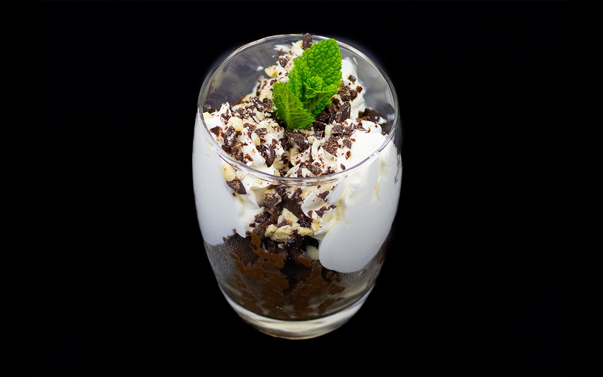 Dessert with whipped cream and chocolate shavings on Budapest Dinner Cruise.