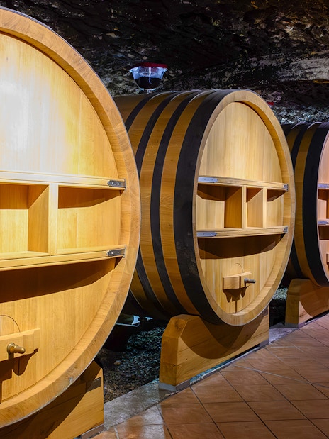Barrels in underground wine cellars, Chateauneuf-du-Pape, Provence.