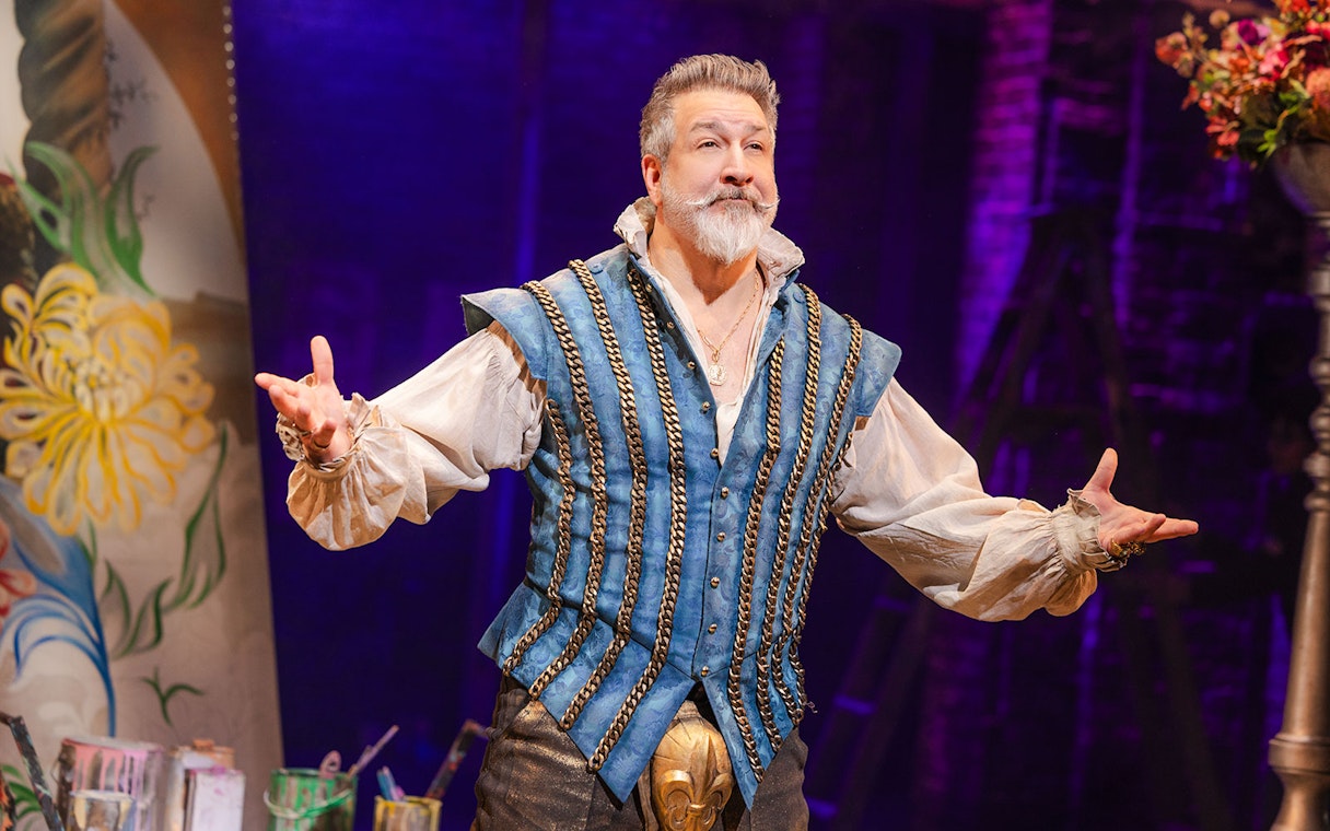 Performer in period costume on stage during & Juliet musical.