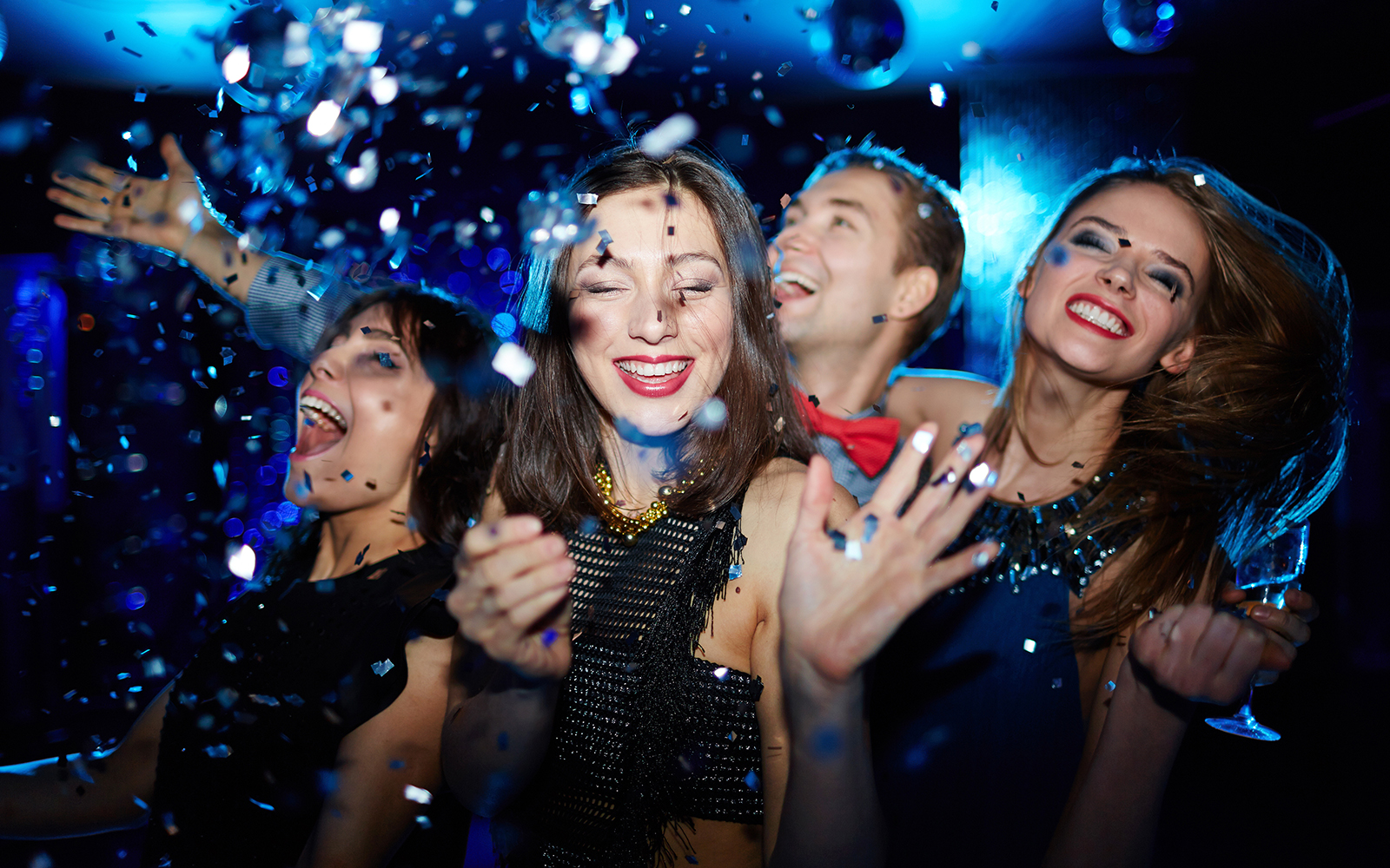 Group of friends dancing in night club