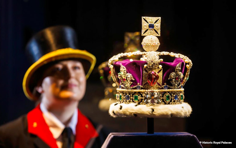 Crown jewels display with a guard in the background at the Tower of London.