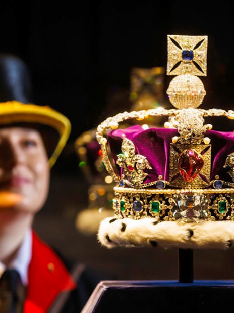 Crown jewels display with a guard in the background at the Tower of London.