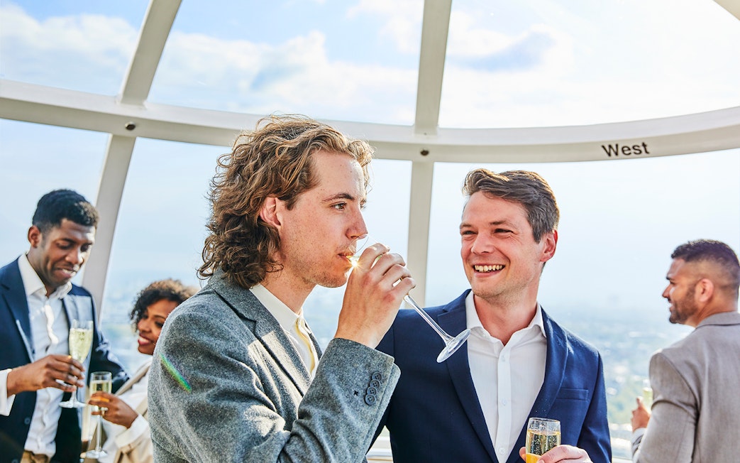 Guests enjoying champagne on the London Eye capsule.