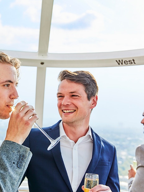 Guests enjoying champagne on the London Eye capsule.