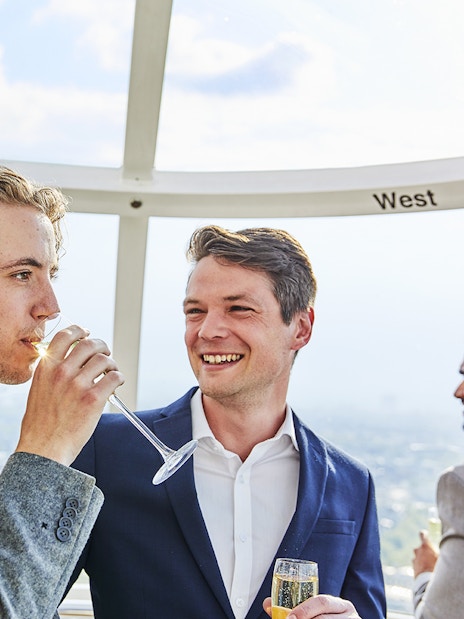 Guests enjoying champagne on the London Eye capsule.
