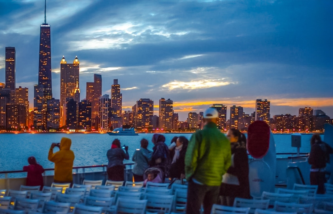 People enjoying a 90-minute scenic sunset cruise on Lake Michigan.