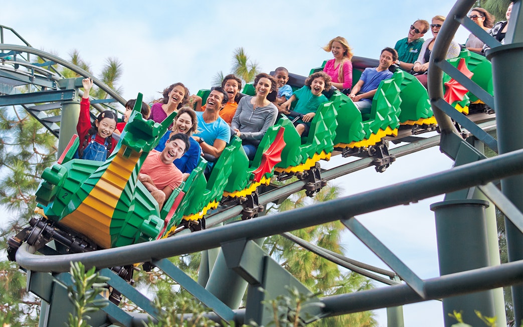 Roller coaster ride at Legoland Korea with excited visitors.