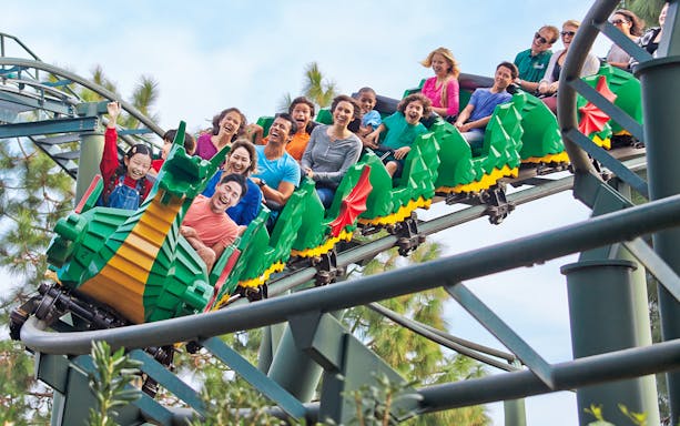 Roller coaster ride at Legoland Korea with excited visitors.
