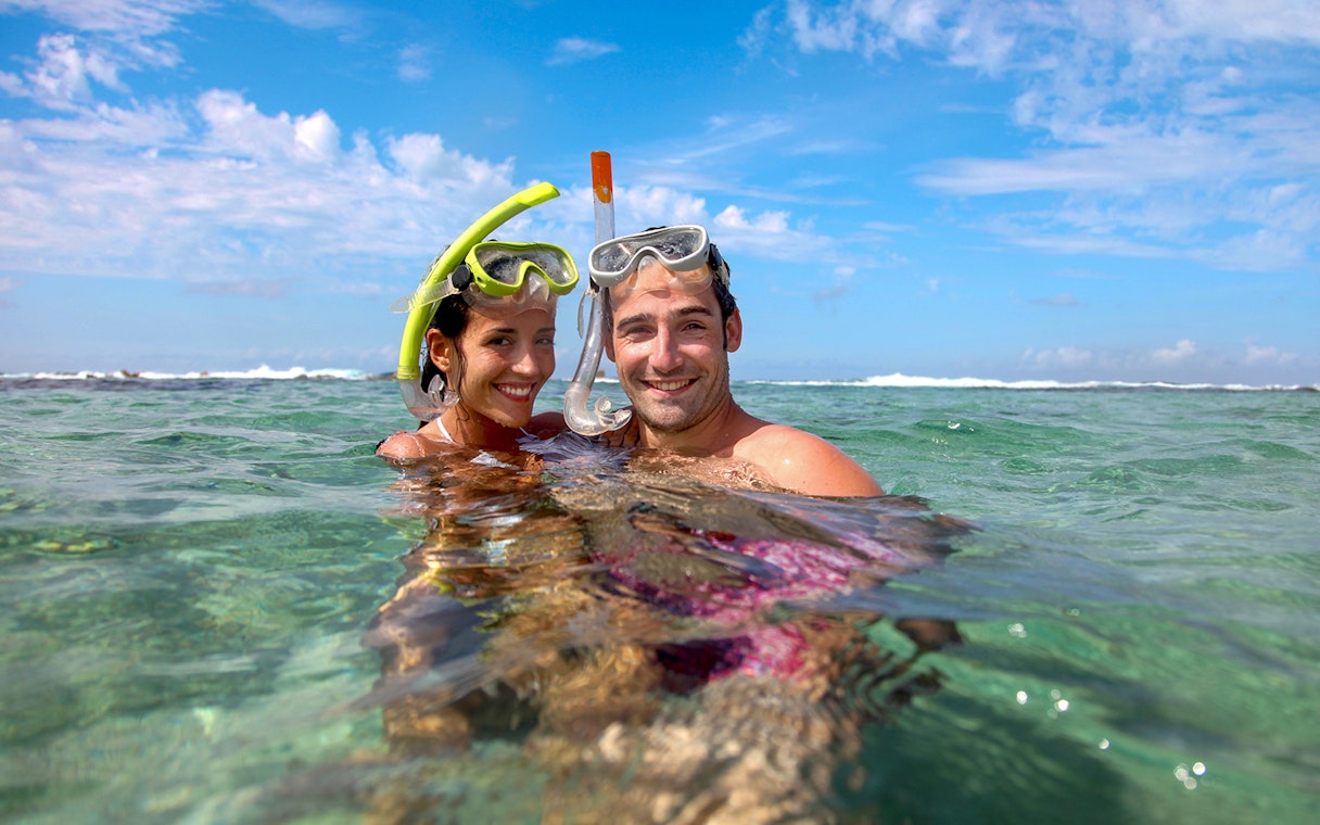 Snorkelers enjoying clear waters on Krabi Hong Island day trip by speed boat.