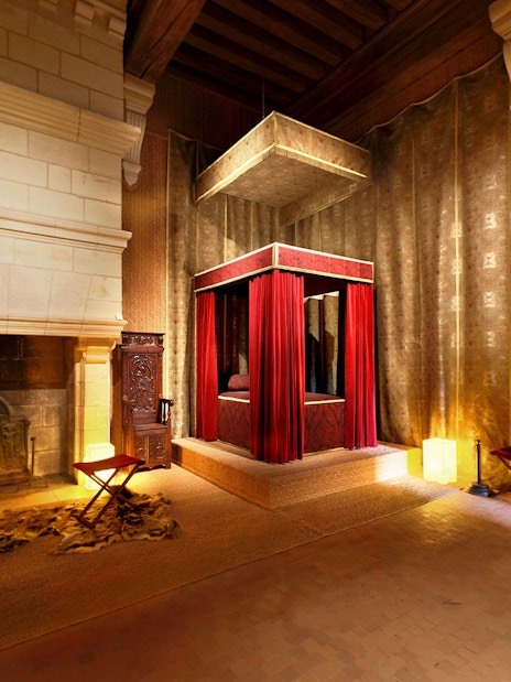Bedroom of François I with canopy bed and fireplace at Château de Chambord, Loire Valley, France.