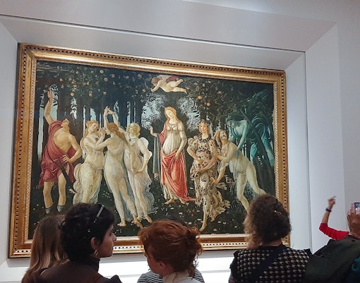 Visitors viewing Botticelli's "Primavera" at the Uffizi Gallery, Florence.