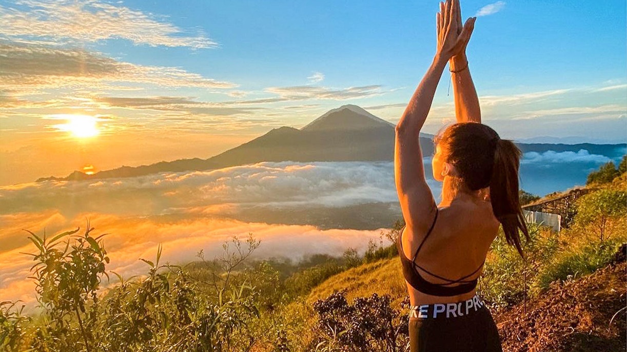 Girl Enjoying sunset on Mount Batur - Bali