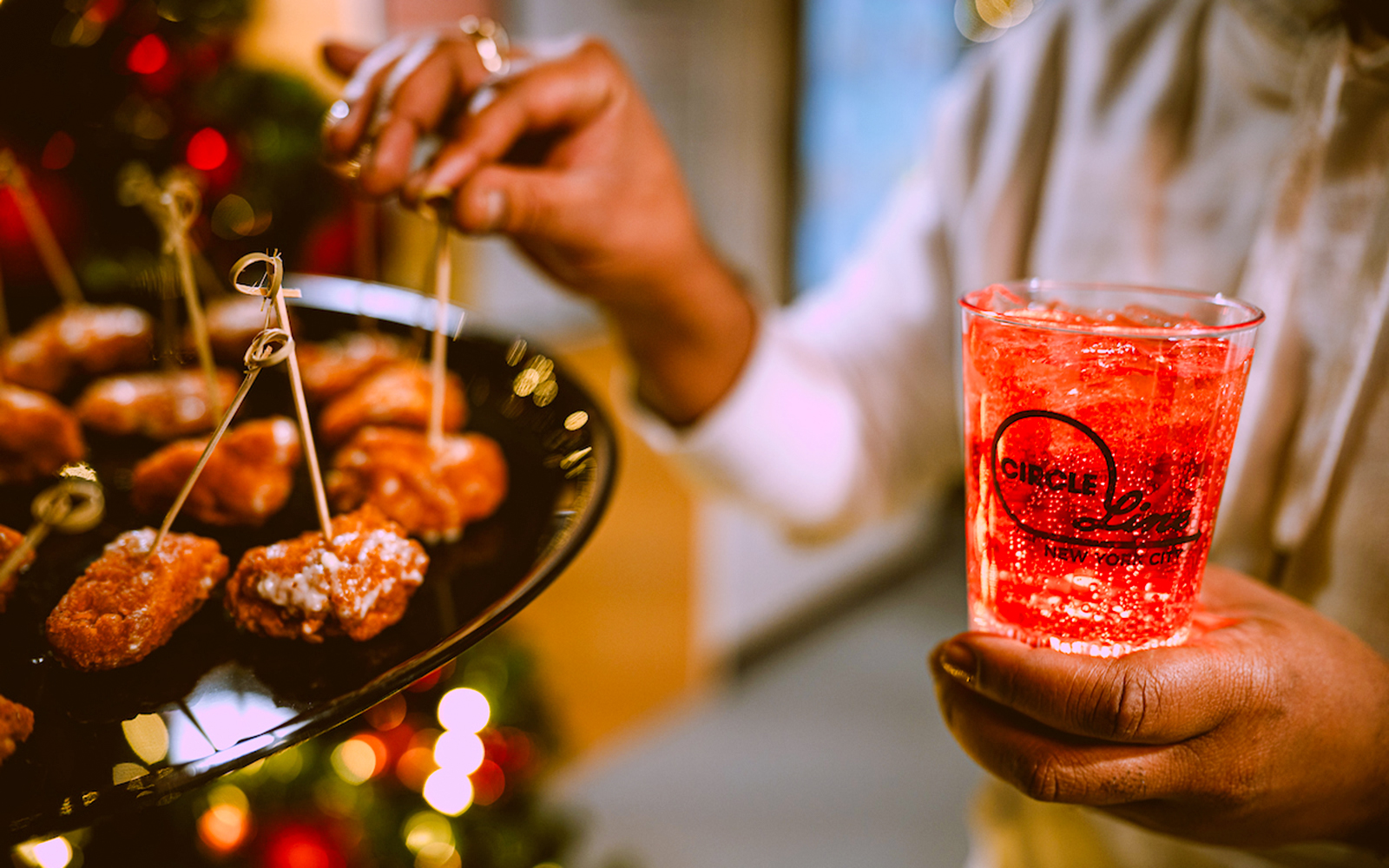 Appetizers and a festive drink on New Year’s Eve Cruise in NYC.