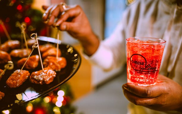 Appetizers and a festive drink on New Year’s Eve Cruise in NYC.