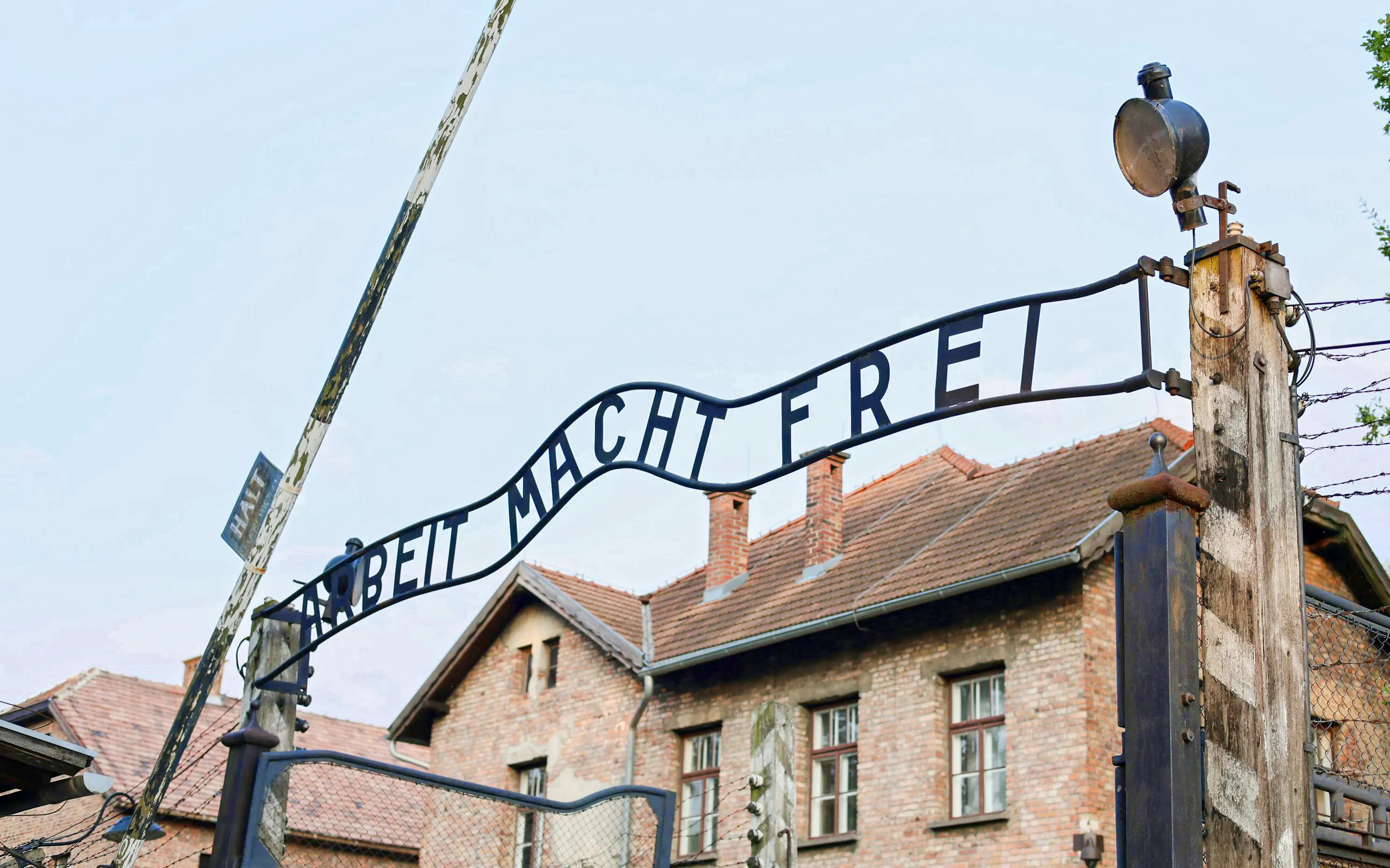 Entrance gate of Auschwitz-Birkenau with "Arbeit Macht Frei" sign, Krakow guided tour.
