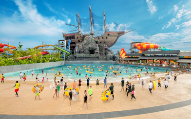 Visitors enjoying the wave pool and slides at SplashMania Waterpark, Gamuda Cove, Selangor.