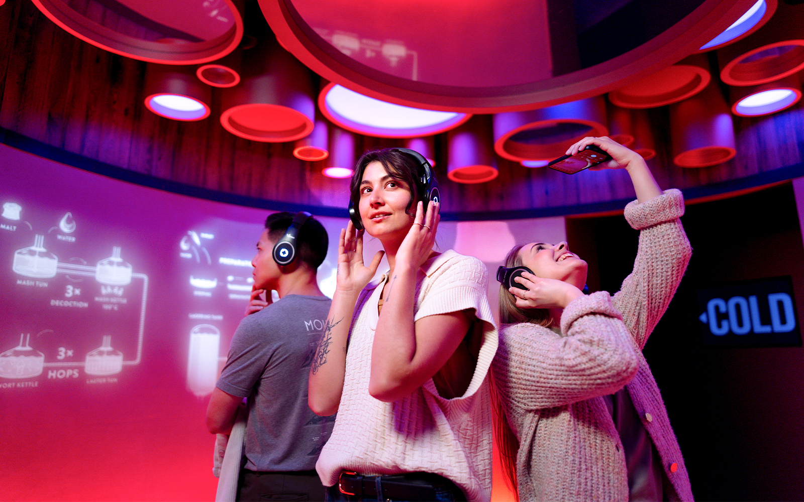 Visitors enjoying interactive beer tasting at Prague Pilsner Urquell Experience.