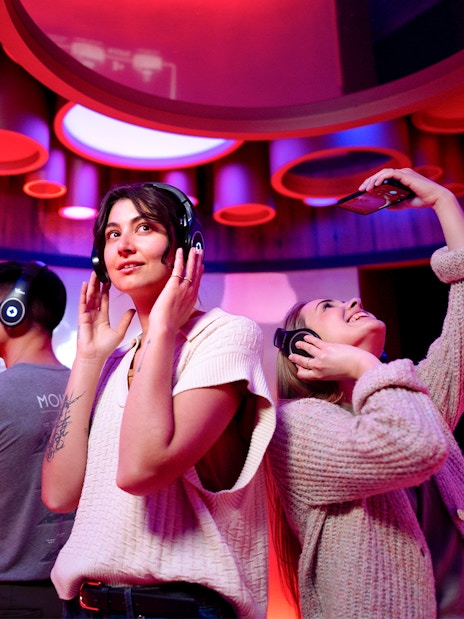 Visitors enjoying interactive beer tasting at Prague Pilsner Urquell Experience.