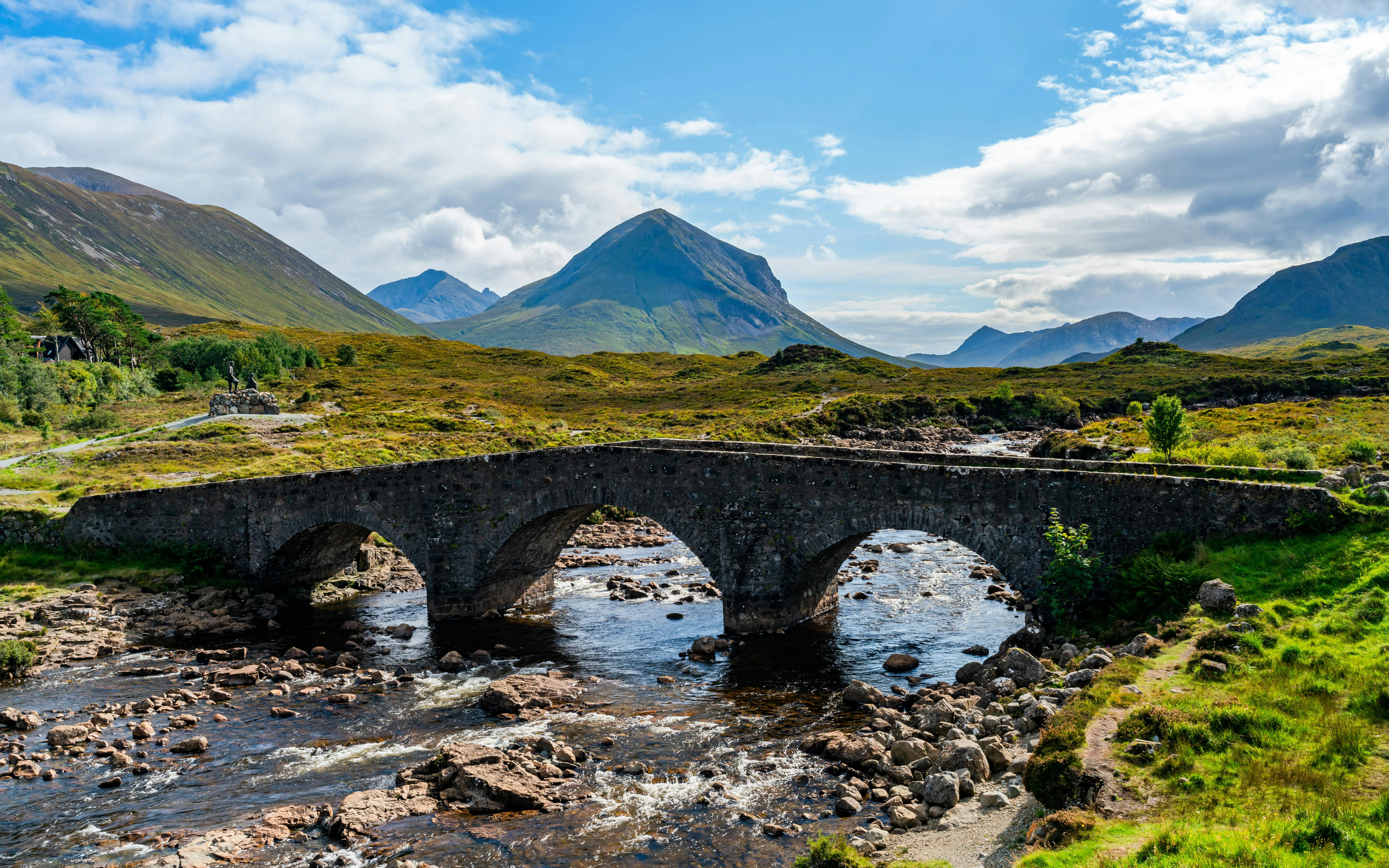 Sligachan Old Bridge over river with mountains in the background, Isle of Skye, Scotland.