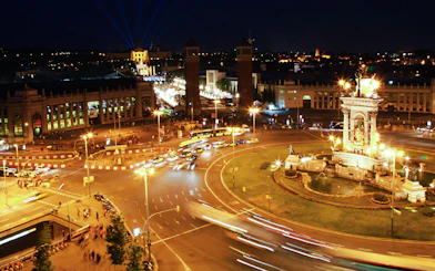 Barcelona's Plaça d'Espanya illuminated at night during a city tour.
