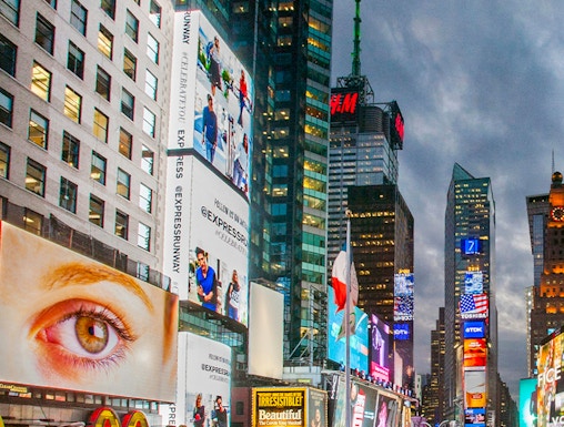 Crowds and bright billboards in Times Square, New York City.