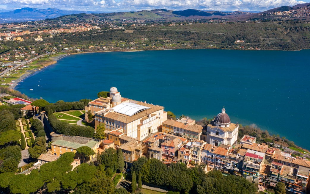 Aerial view of the Papal Palace of Castel Gandolfo overlooking Lake Albano near Rome, Italy.