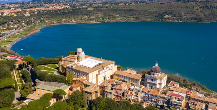 Aerial view of the Papal Palace of Castel Gandolfo overlooking Lake Albano near Rome, Italy.