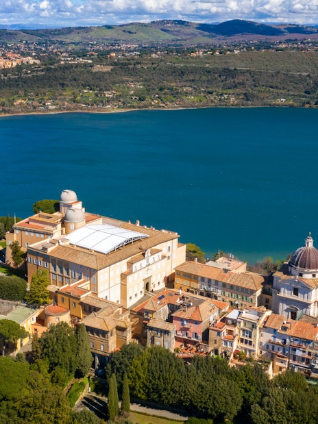 Aerial view of the Papal Palace of Castel Gandolfo overlooking Lake Albano near Rome, Italy.