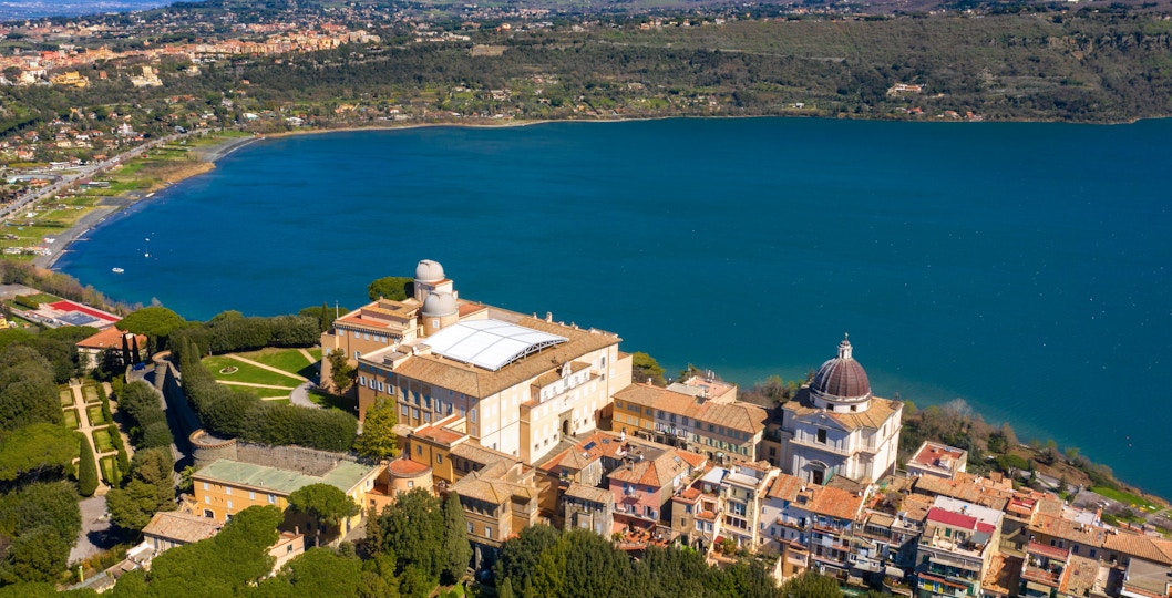 Aerial view of the Papal Palace of Castel Gandolfo overlooking Lake Albano near Rome, Italy.