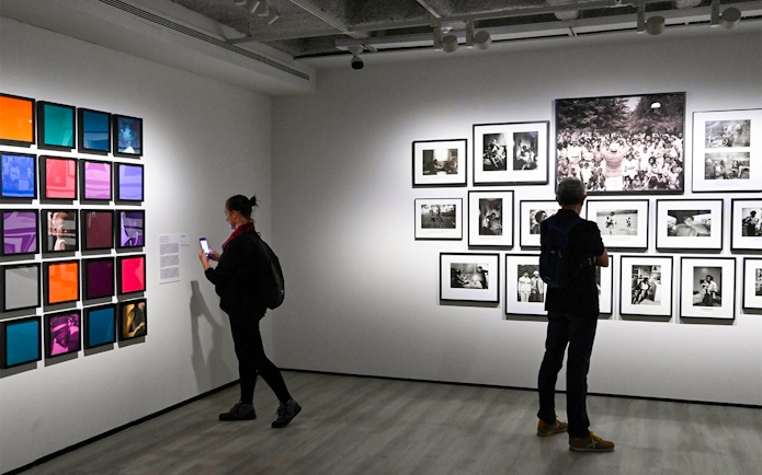 Visitors viewing art exhibits at KBr Photography Center, Fundación MAPFRE, Barcelona.