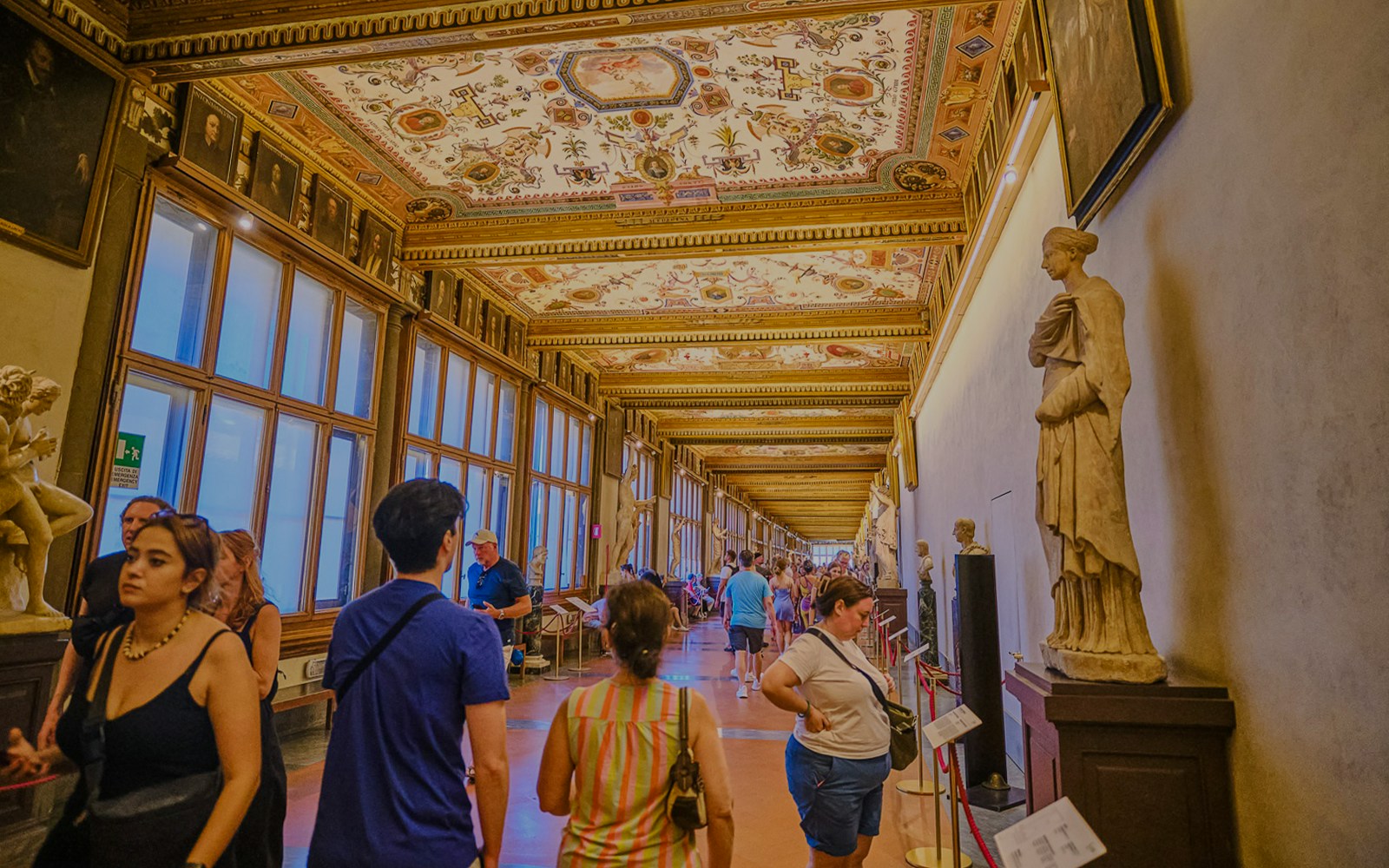 Vasari Corridor view with Uffizi Gallery artworks, Florence private tour.