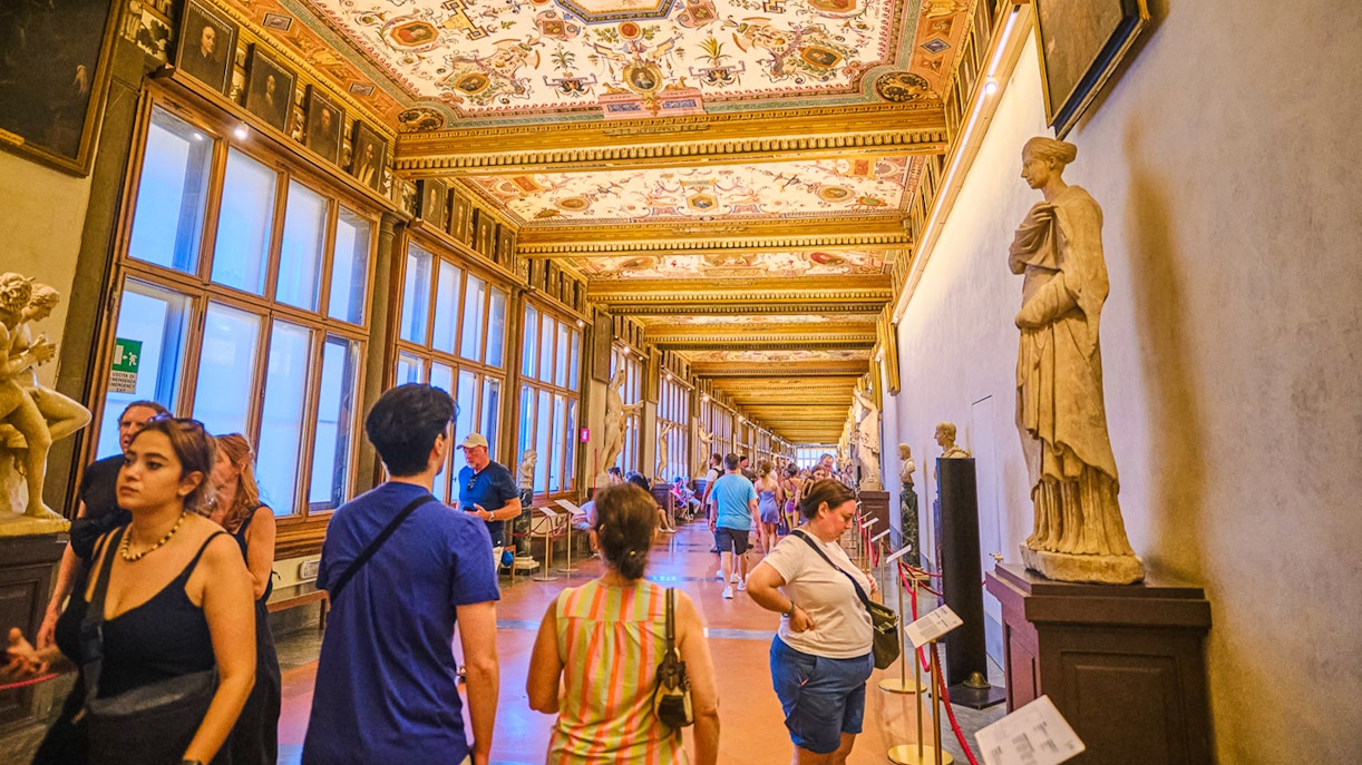 Vasari Corridor view with Uffizi Gallery artworks, Florence private tour.