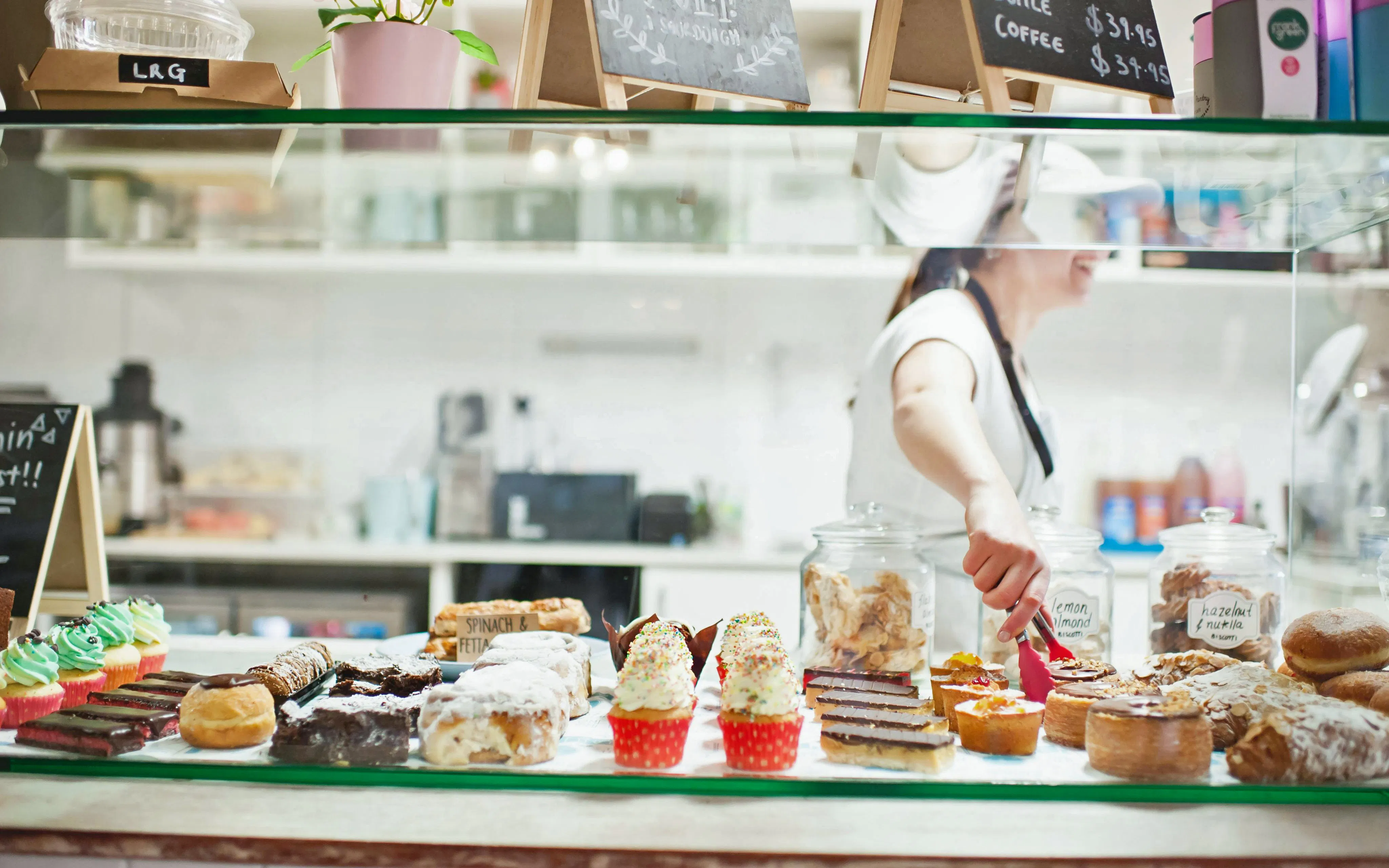 Pastries and cakes on display at a SoHo cafe counter.