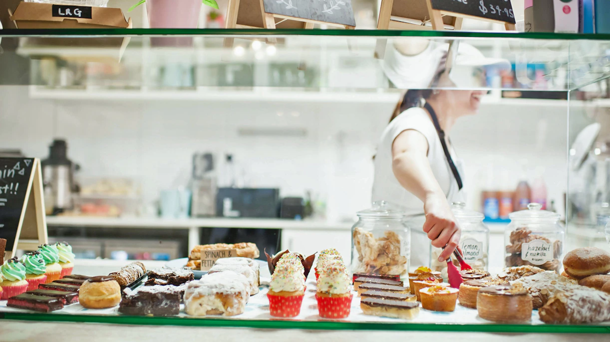 Pastries and cakes on display at a SoHo cafe counter.
