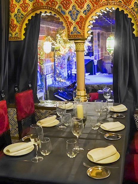 Dining area with ornate decor at Torres Bermejas Flamenco, Madrid.