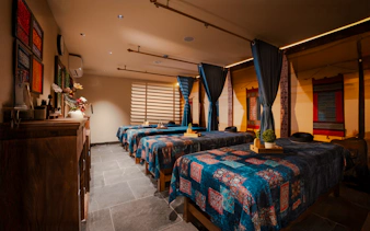 Herbal Spa in Da Nang with massage tables and traditional decor.