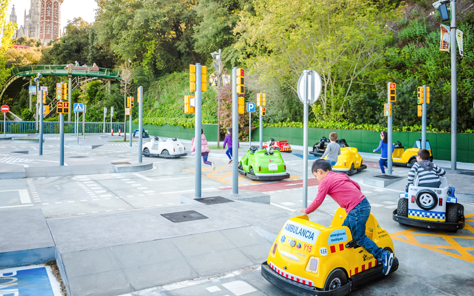 Children driving mini cars at Tibicity in Tibidabo Amusement Park, Barcelona.