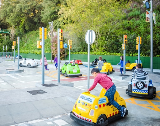 Children driving mini cars at Tibicity in Tibidabo Amusement Park, Barcelona.