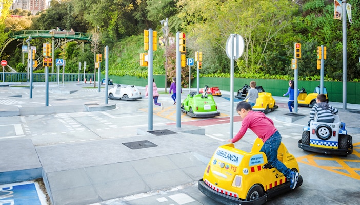 Children driving mini cars at Tibicity in Tibidabo Amusement Park, Barcelona.