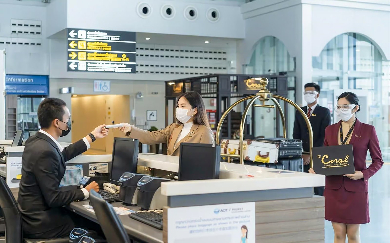 Fast-track service at Donmuang Airport with staff assisting travelers at check-in counter.