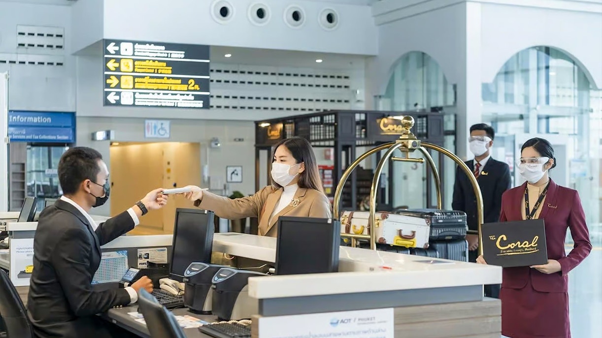 Fast-track service at Donmuang Airport with staff assisting travelers at check-in counter.