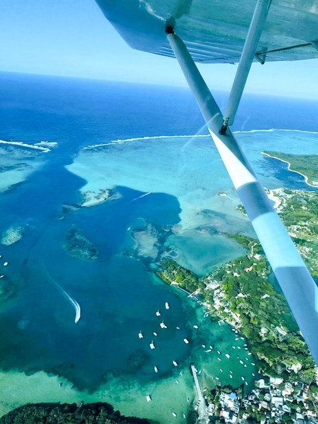 Aerial view of Mauritius coastline from seaplane on Short Amber Route Scenic Tour.