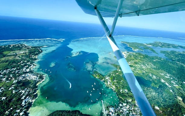 Aerial view of Mauritius coastline from seaplane on Short Amber Route Scenic Tour.