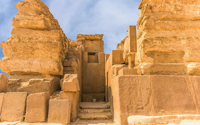 Entrance to the Giza Pyramids complex, showcasing ancient stone architecture.